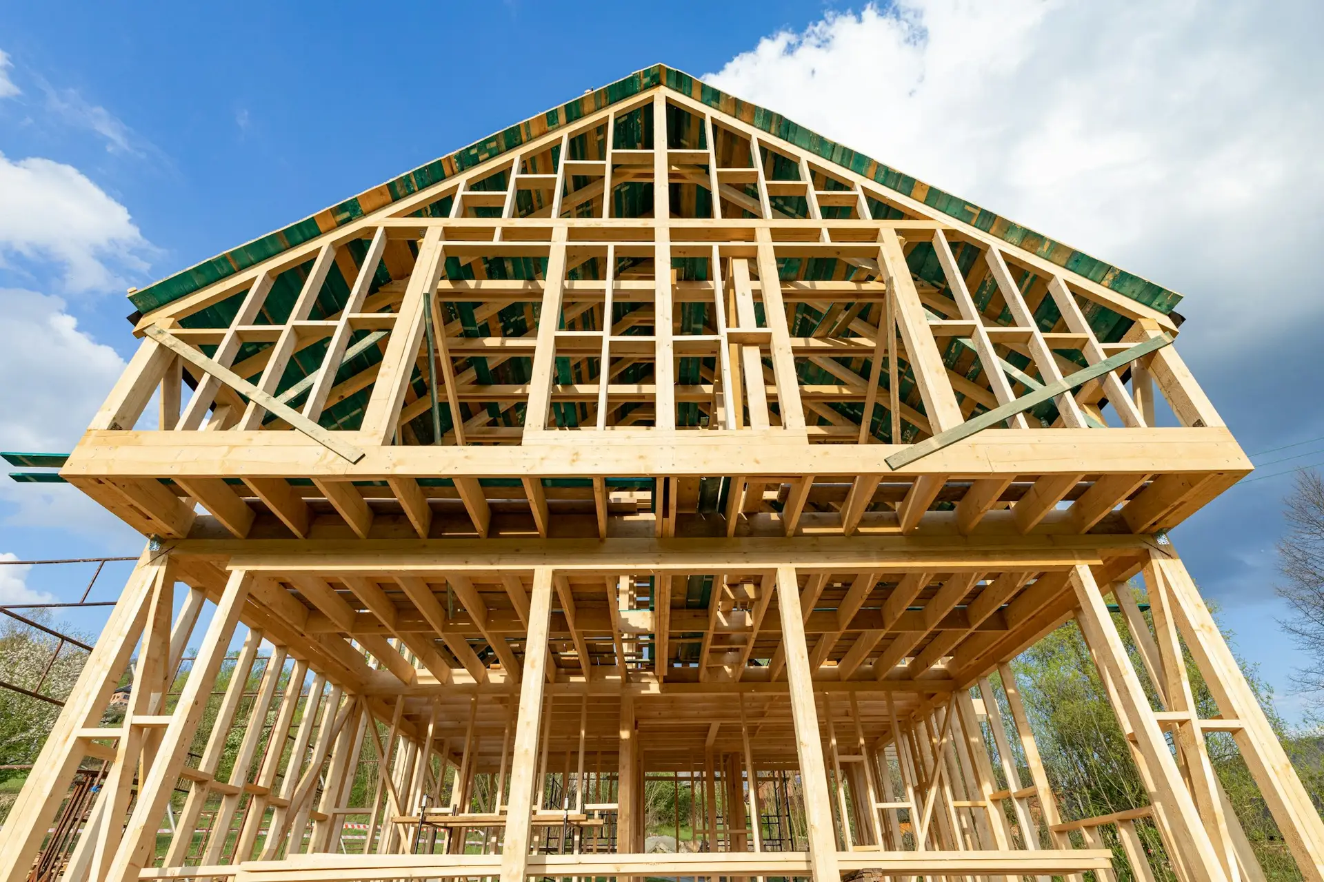 New wooden frame house under construction, outdoor residential home